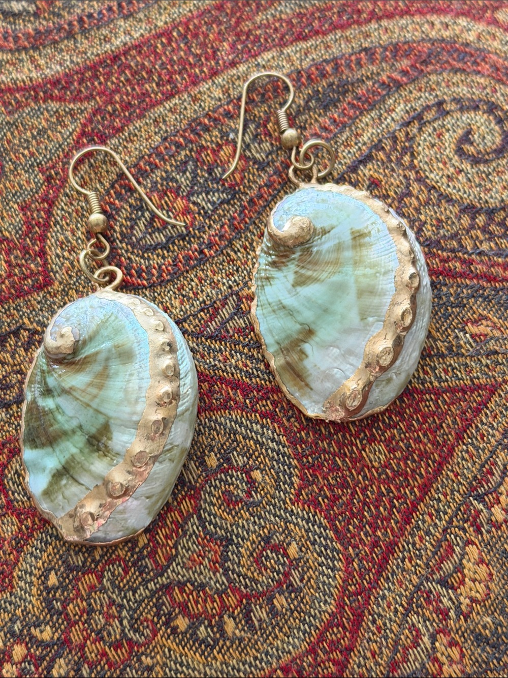 Paui shell earrings pierced gold leaf detail on the back and front of the shells